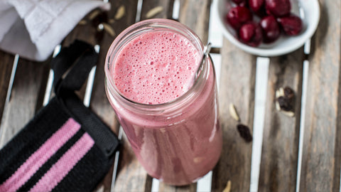 A pink frothy pre workout drink with fruits in the background. But what are the 7 pre workout ingredients to avoid?